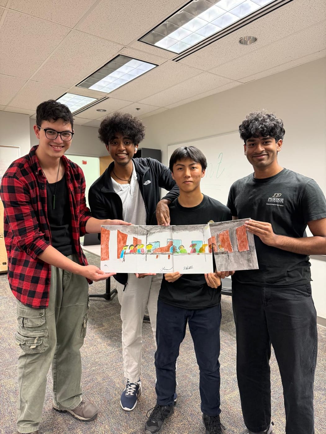 Members holding up a collaborative watercolor from paint night