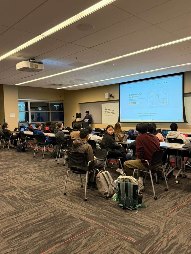 A member presenting a personal website project to the room